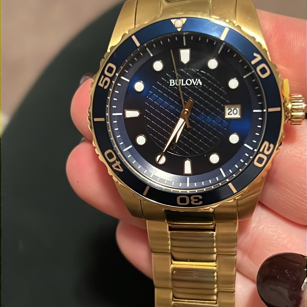 Bulova sport gold tone and navy watch